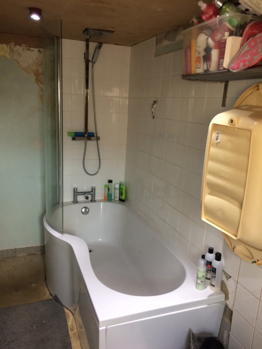 A before shot of the bath tub and room