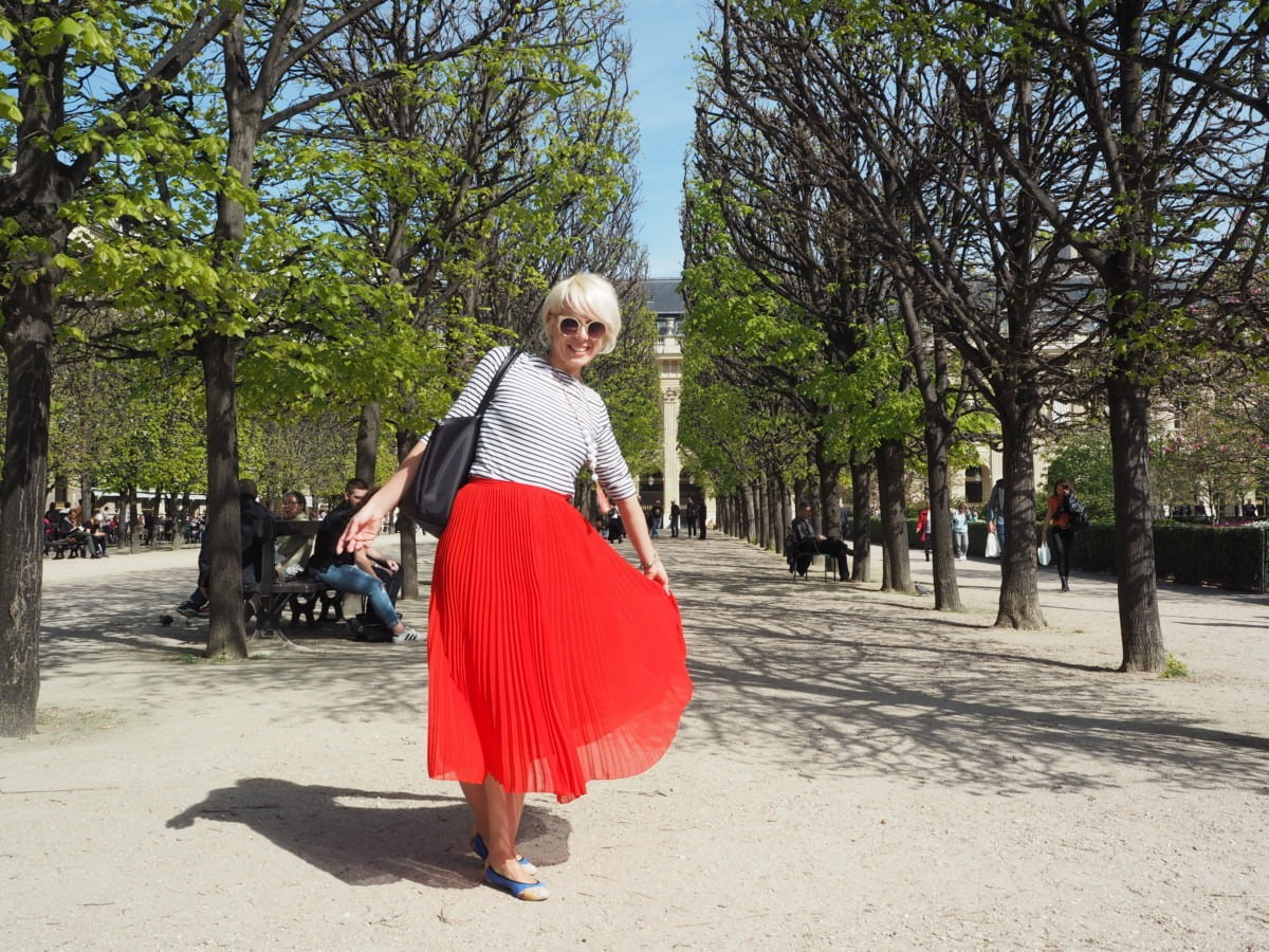 Maxine posing with a red dress