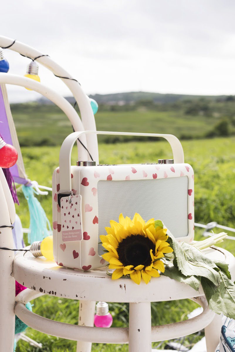 A love heart radio with a sunflower on a stool