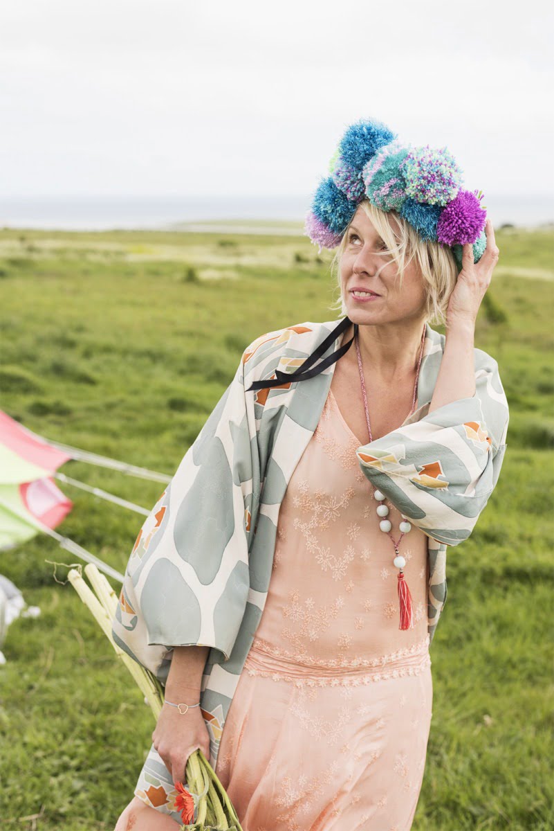 Maxine with a pom pom headdress