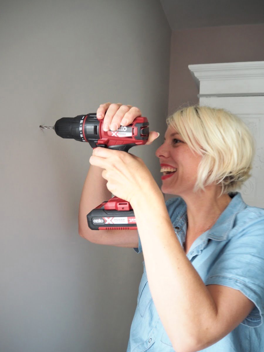 How to perfectly hang a mirror with just a few power tools, a jumpsuit and a bit of reddy lippy by Blogger + Interior Stylist Maxine Brady 