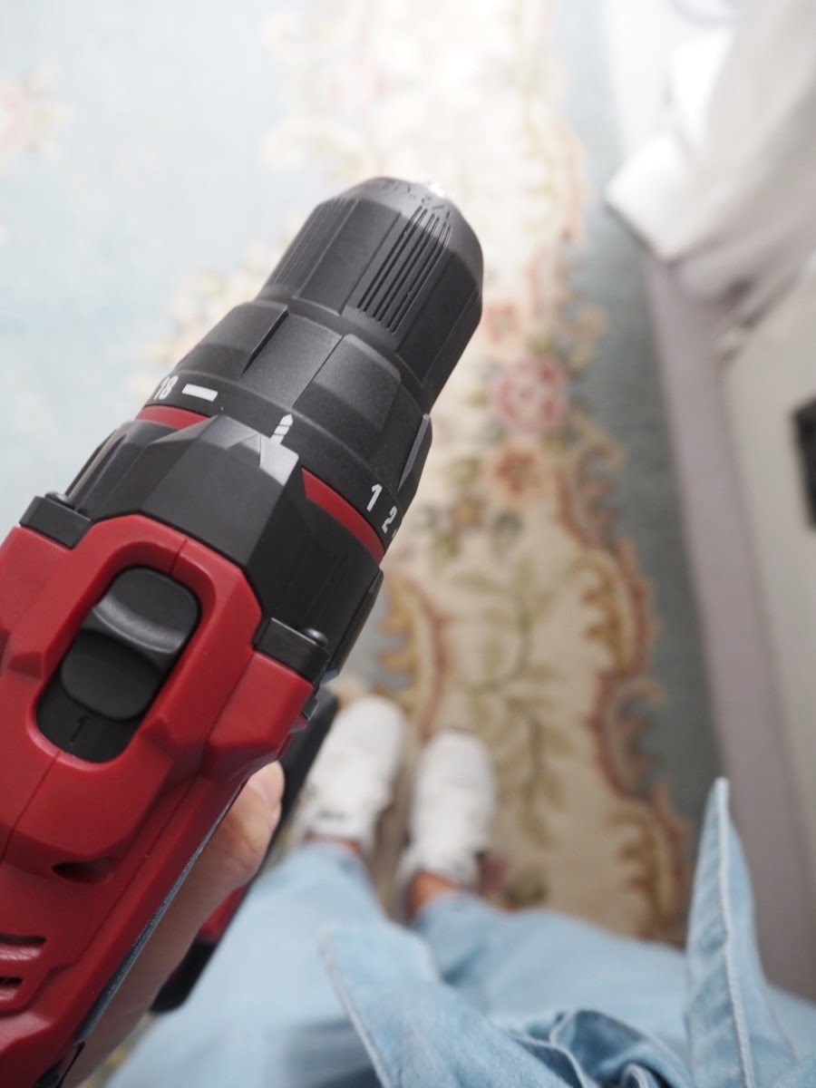 How to perfectly hang a mirror with just a few power tools, a jumpsuit and a bit of reddy lippy by Blogger + Interior Stylist Maxine Brady 