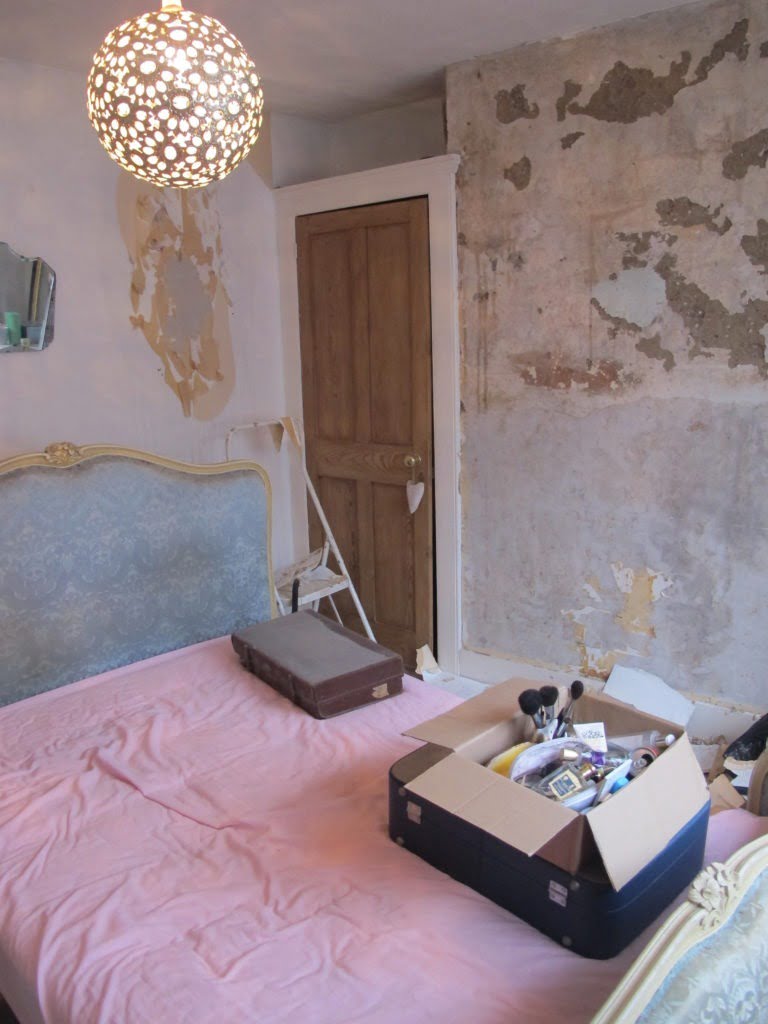 Guide to how to DIY your walls to get a distressed look by hacking off the plaster and treating it. It's cheap to do, looks brilliant and creates a real statement look in a home by interior stylist Maxine Brady.