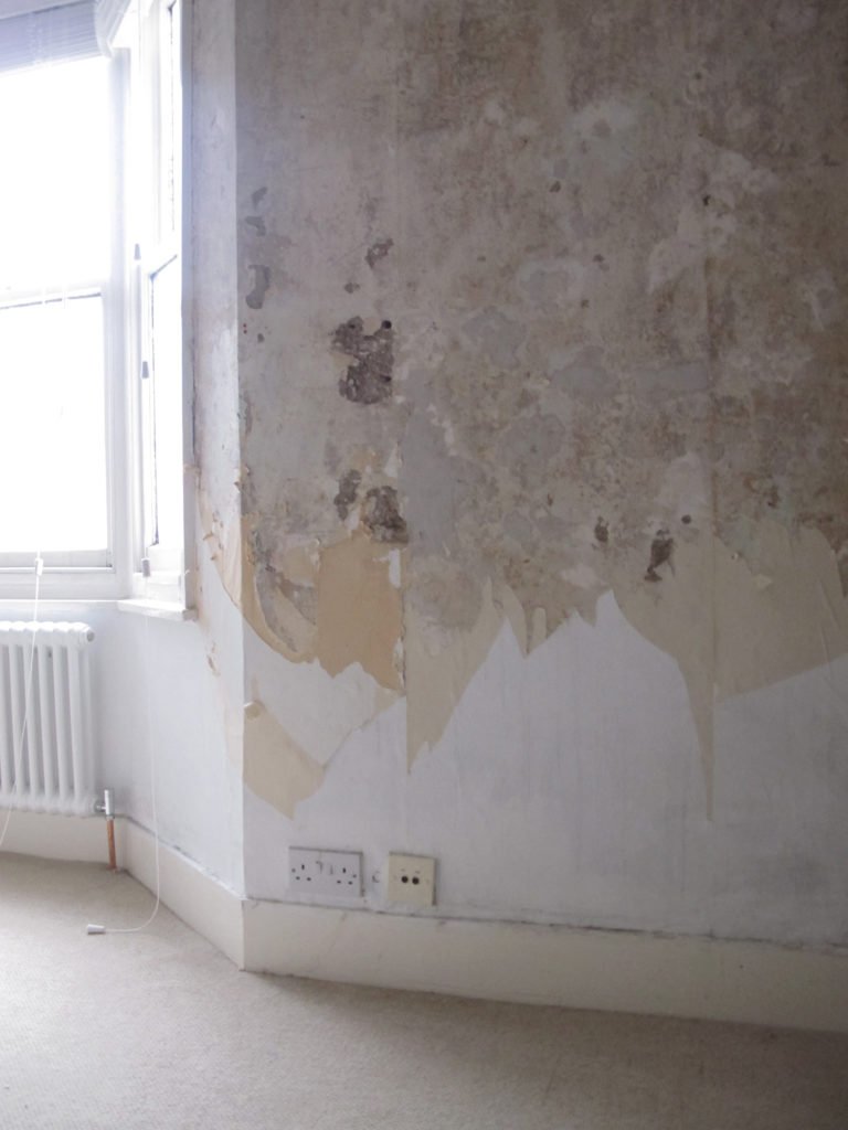 Guide to how to DIY your walls to get a distressed look by hacking off the plaster and treating it. It's cheap to do, looks brilliant and creates a real statement look in a home by interior stylist Maxine Brady.