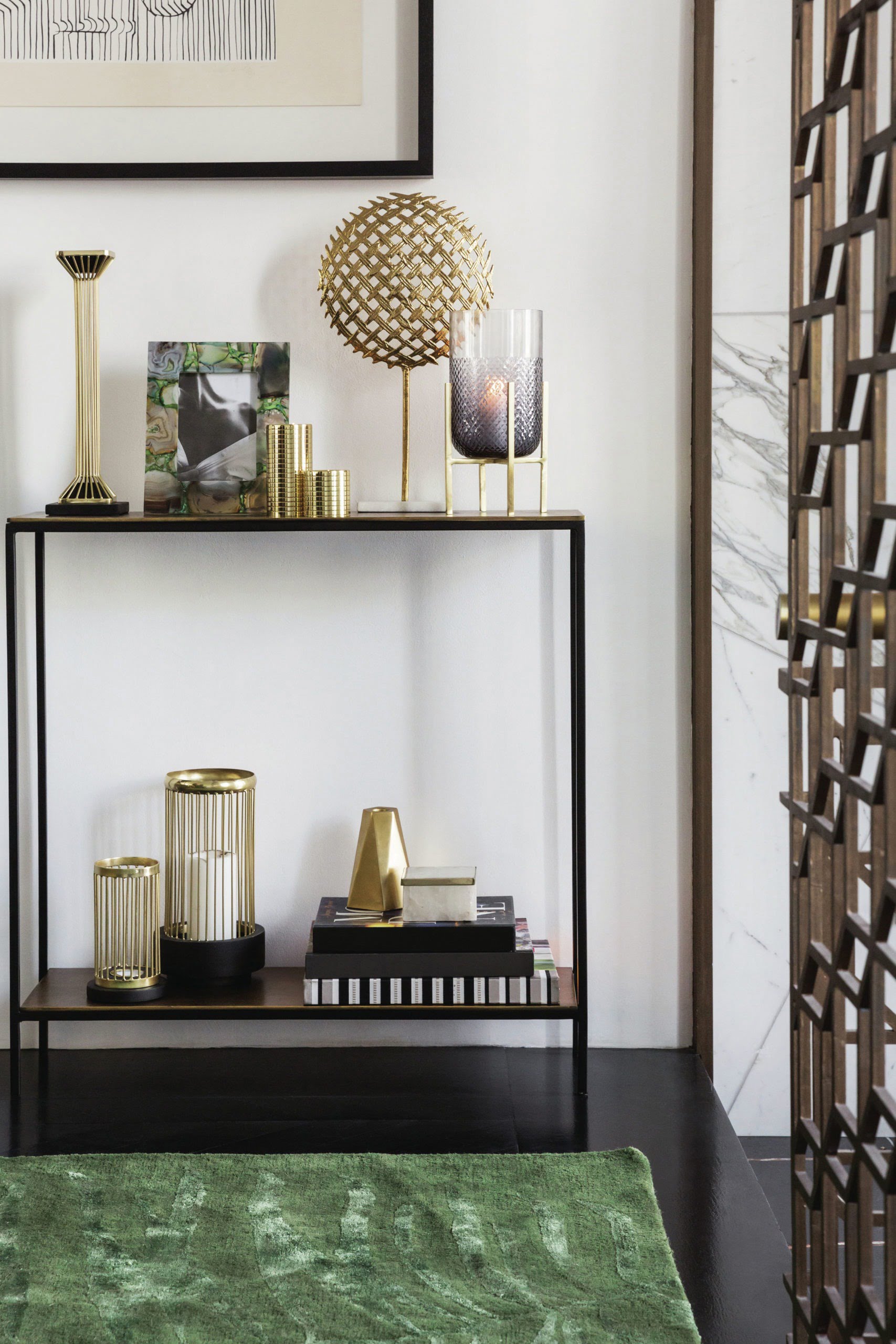 small shelving unit with gold accessories and candles

Tips and tricks on how to style your home so that you can create a space you'll love with tips from interior stylist Maxine Brady