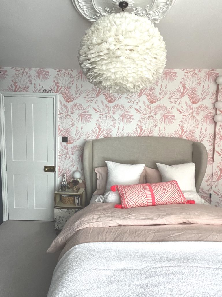 Step inside interior stylist Maxine Brady's cool bedroom redesign that is filled with clever storage ideas, pretty wallpaper and navy fitted wardrobes to create a dreamy room