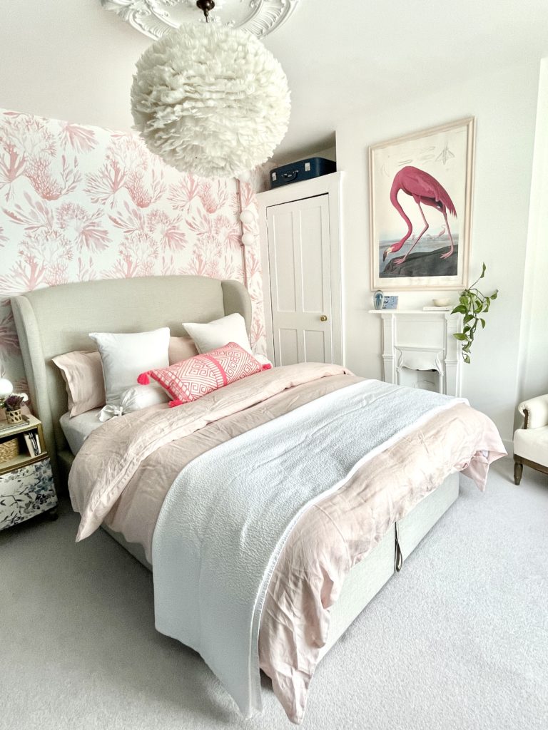 Step inside interior stylist Maxine Brady's cool bedroom redesign that is filled with clever storage ideas, pretty wallpaper and navy fitted wardrobes to create a dreamy room