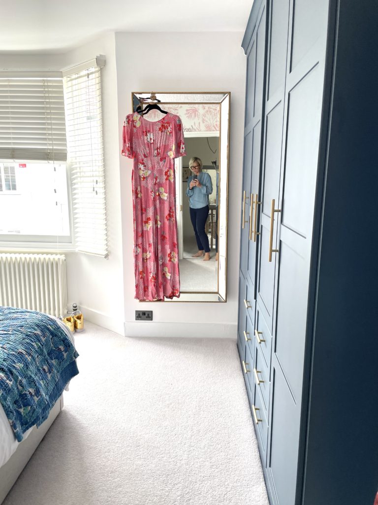 Step inside interior stylist Maxine Brady's cool bedroom redesign that is filled with clever storage ideas, pretty wallpaper and navy fitted wardrobes to create a dreamy room