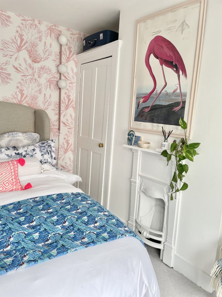Step inside interior stylist Maxine Brady's cool bedroom redesign that is filled with clever storage ideas, pretty wallpaper and navy fitted wardrobes to create a dreamy room