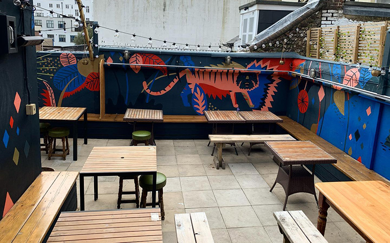 As Brighton local. here are 12 of my favourites, from leafy courtyards to proper rooftop bars with sea views. 
