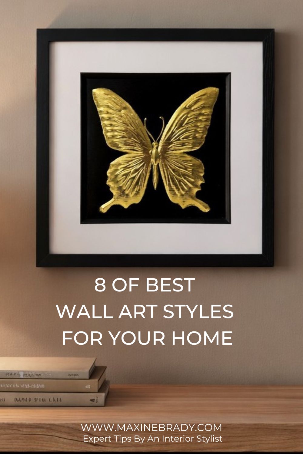How to choose wall art for your home: Gold butterfly wall art in a black frame styled above a wooden console table